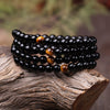 Bracelet mala onyx noir avec œil de tigre - l'atelier d'eos