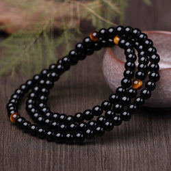 Bracelet mala onyx noir avec œil de tigre - l'atelier d'eos
